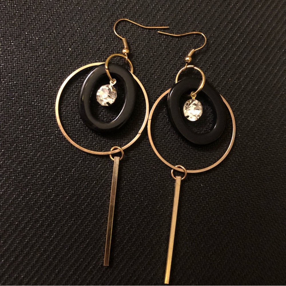 Gold and black circle dangling earrings with bar and gem